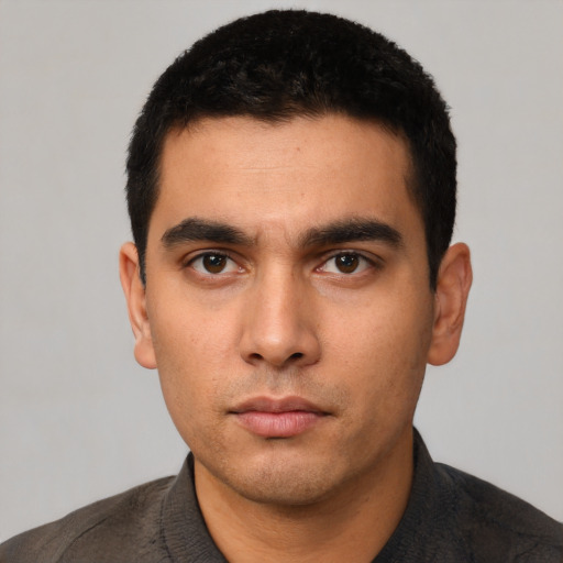 Neutral white young-adult male with short  black hair and brown eyes