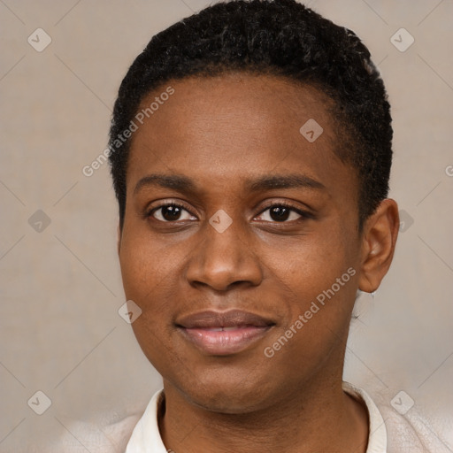 Joyful black young-adult female with short  black hair and brown eyes