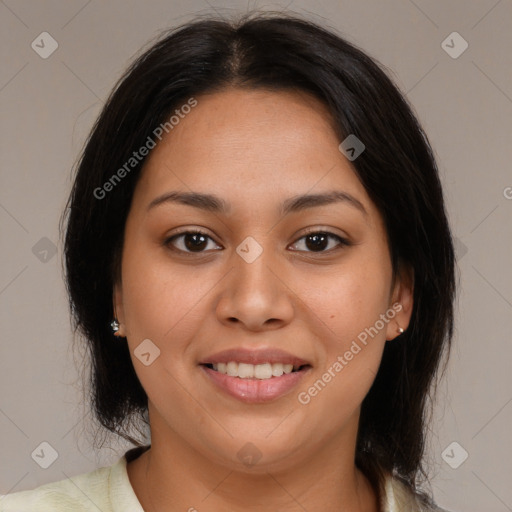 Joyful latino young-adult female with medium  brown hair and brown eyes