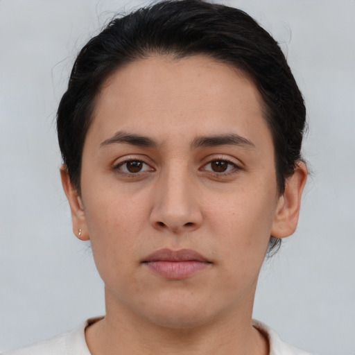 Neutral white young-adult female with short  brown hair and brown eyes