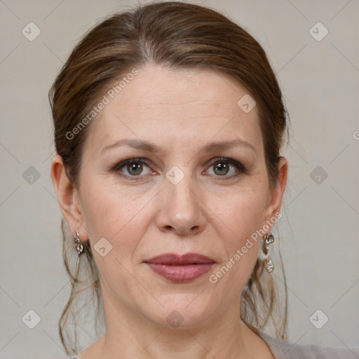 Joyful white adult female with medium  brown hair and grey eyes