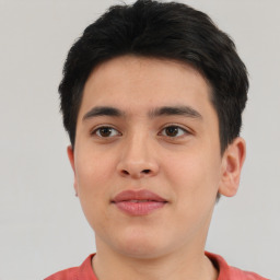 Joyful asian young-adult male with short  brown hair and brown eyes