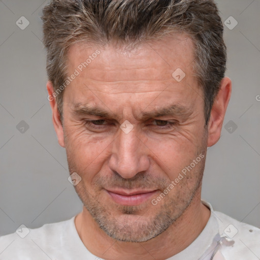 Joyful white middle-aged male with short  brown hair and brown eyes