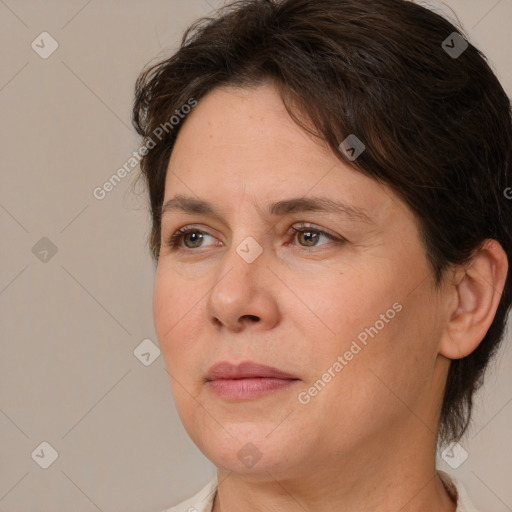 Joyful white adult female with short  brown hair and brown eyes