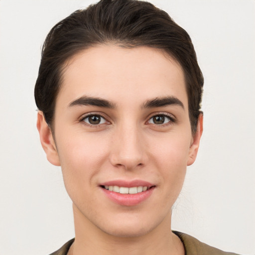 Joyful white young-adult female with short  brown hair and brown eyes