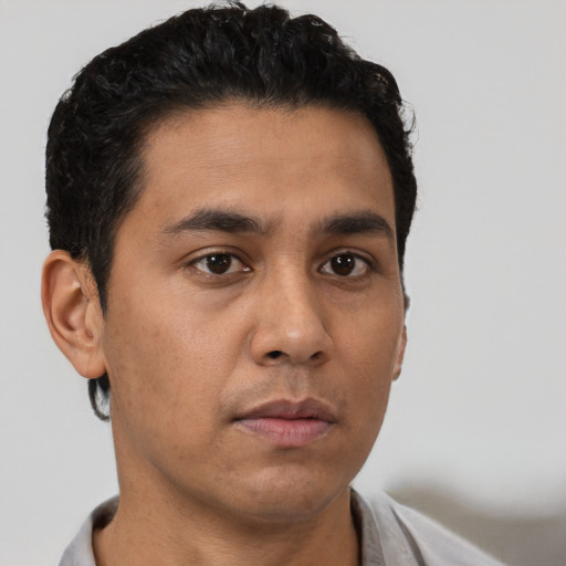 Neutral latino young-adult male with short  brown hair and brown eyes