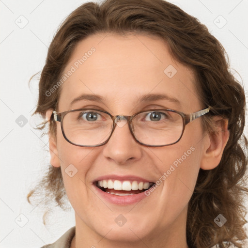 Joyful white adult female with medium  brown hair and green eyes