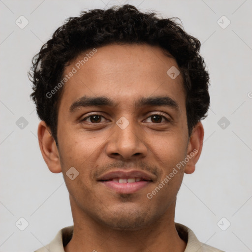 Joyful latino young-adult male with short  brown hair and brown eyes