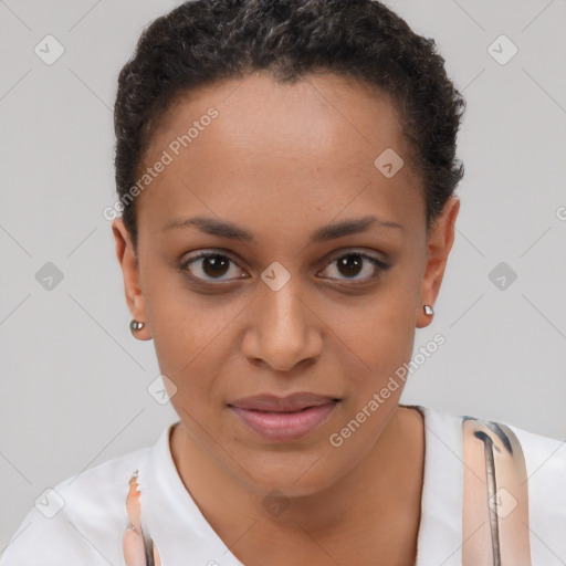 Joyful black young-adult female with short  brown hair and brown eyes