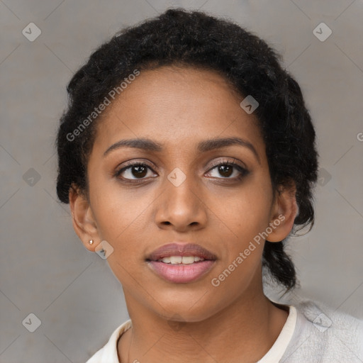 Joyful black young-adult female with short  black hair and brown eyes