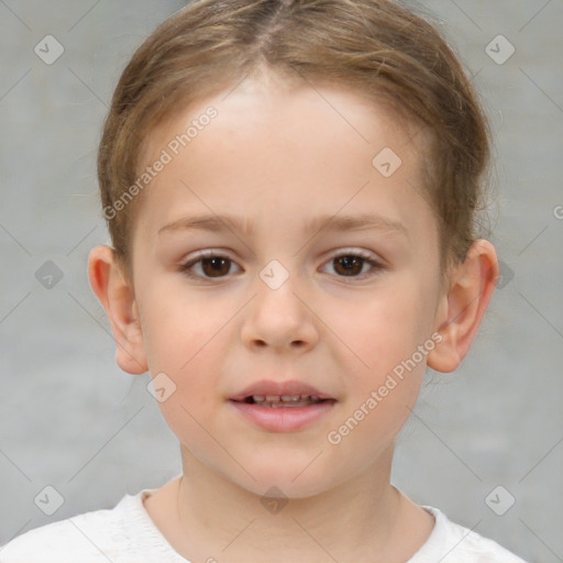 Joyful white child female with short  brown hair and brown eyes