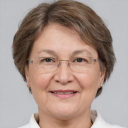 Joyful white middle-aged female with medium  brown hair and brown eyes