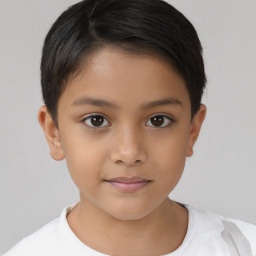 Joyful white child female with short  brown hair and brown eyes