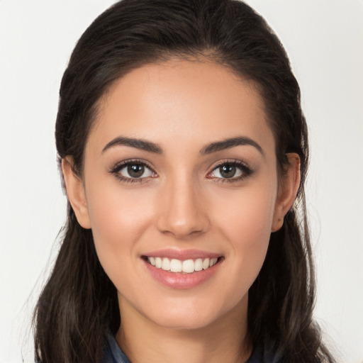 Joyful white young-adult female with long  brown hair and brown eyes