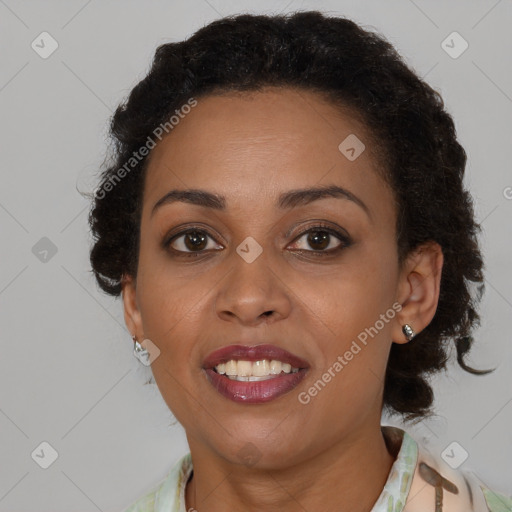 Joyful black young-adult female with medium  brown hair and brown eyes