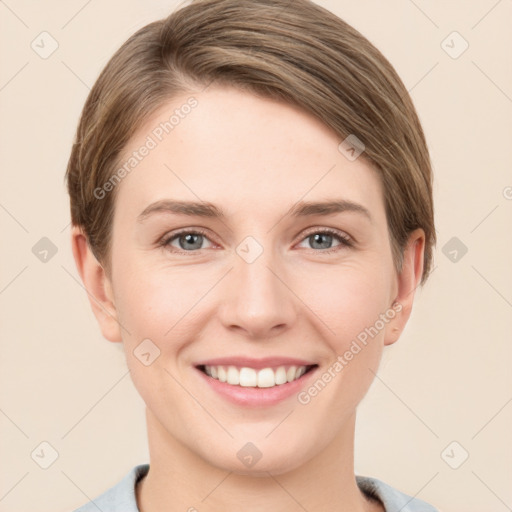 Joyful white young-adult female with short  brown hair and grey eyes