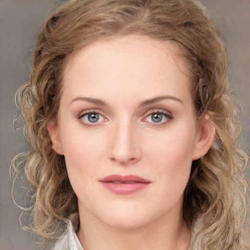 Joyful white young-adult female with medium  brown hair and green eyes