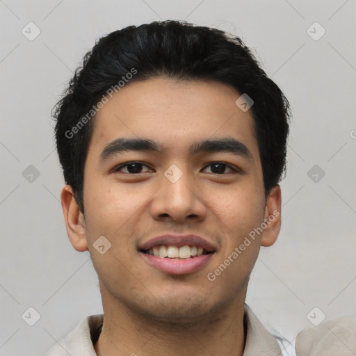 Joyful asian young-adult male with short  black hair and brown eyes