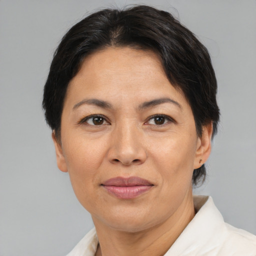 Joyful asian adult female with short  brown hair and brown eyes