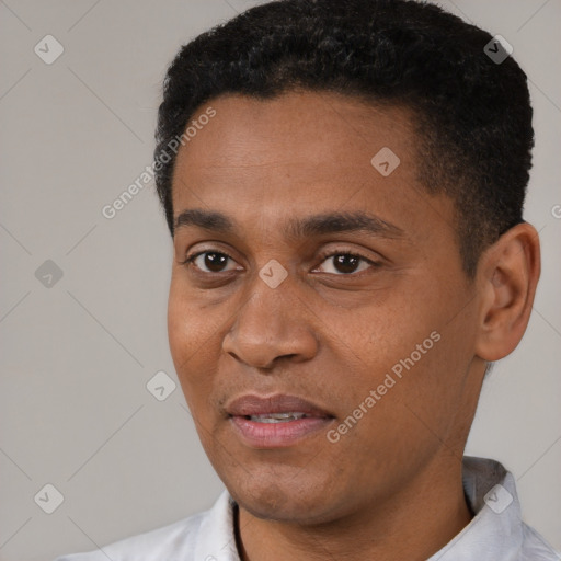 Joyful black young-adult male with short  black hair and brown eyes