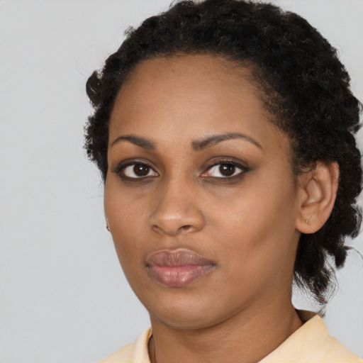 Neutral black young-adult female with medium  black hair and brown eyes