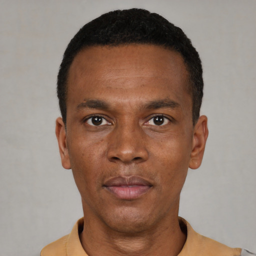 Neutral black young-adult male with short  black hair and brown eyes