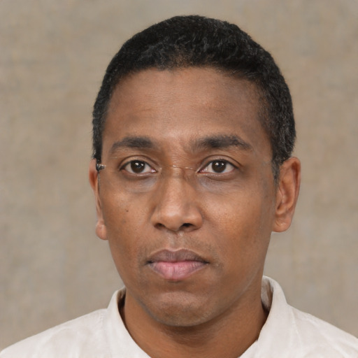 Neutral black young-adult male with short  black hair and brown eyes