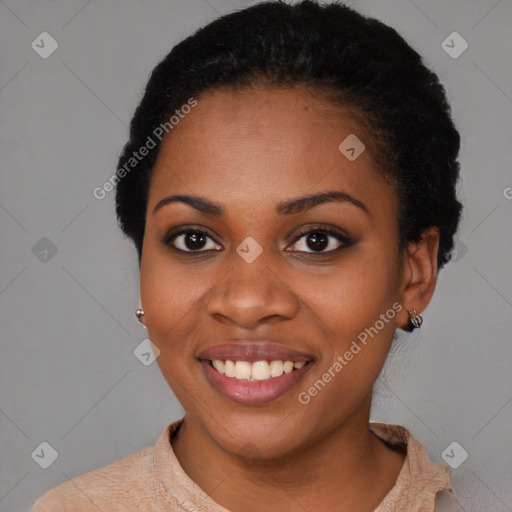 Joyful black young-adult female with short  black hair and brown eyes