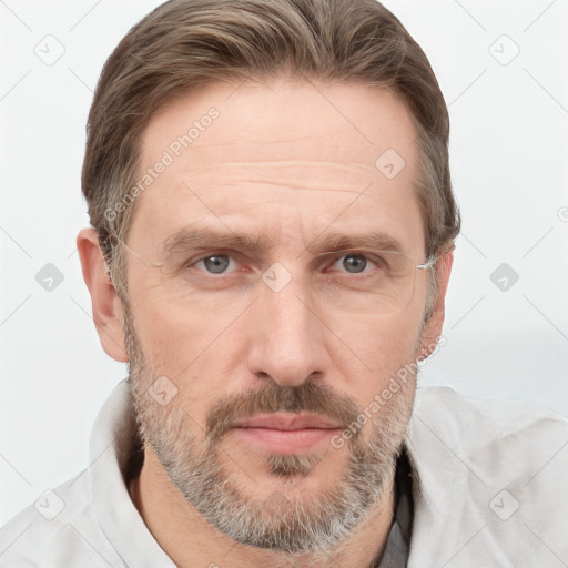 Joyful white adult male with short  brown hair and grey eyes