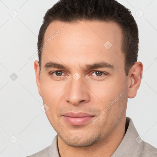 Joyful white young-adult male with short  brown hair and brown eyes