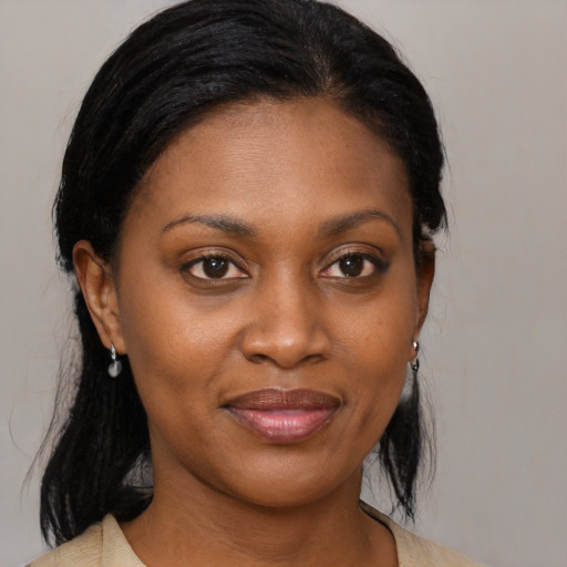 Joyful black young-adult female with medium  black hair and brown eyes