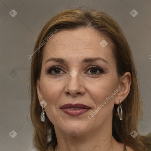 Joyful white adult female with long  brown hair and brown eyes