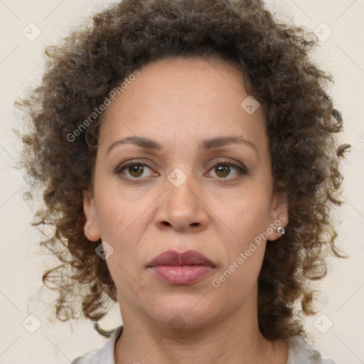 Joyful black adult female with medium  brown hair and brown eyes