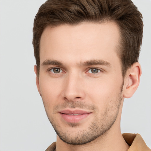 Joyful white young-adult male with short  brown hair and brown eyes