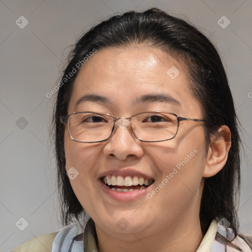 Joyful white adult female with medium  brown hair and brown eyes