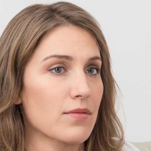 Neutral white young-adult female with long  brown hair and grey eyes