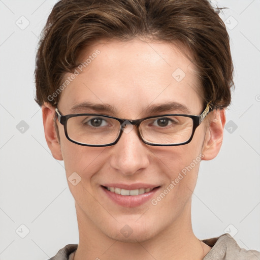 Joyful white young-adult female with short  brown hair and grey eyes