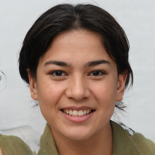 Joyful asian young-adult female with medium  brown hair and brown eyes