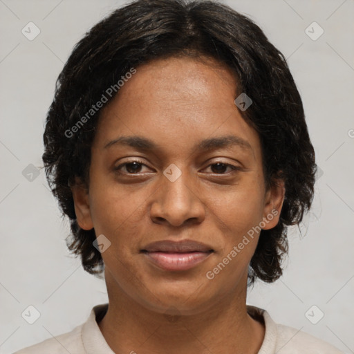 Joyful black adult female with medium  brown hair and brown eyes