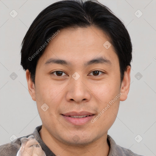 Joyful asian young-adult male with short  brown hair and brown eyes