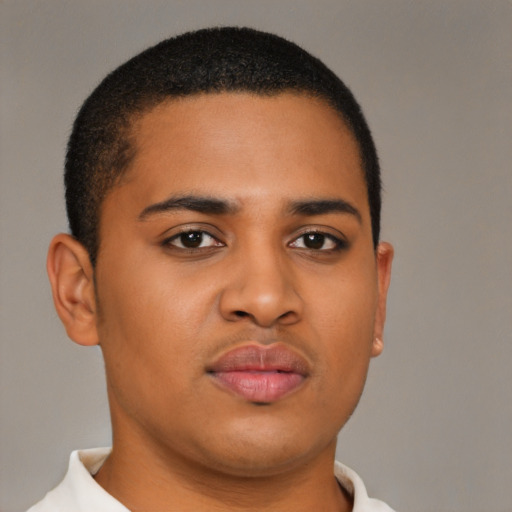 Joyful latino young-adult male with short  brown hair and brown eyes