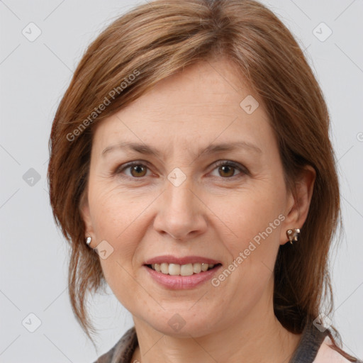 Joyful white adult female with medium  brown hair and brown eyes