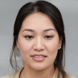 Joyful asian young-adult female with medium  brown hair and brown eyes