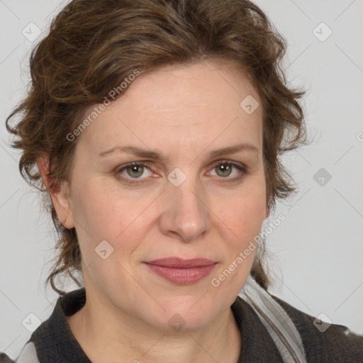 Joyful white adult female with medium  brown hair and blue eyes