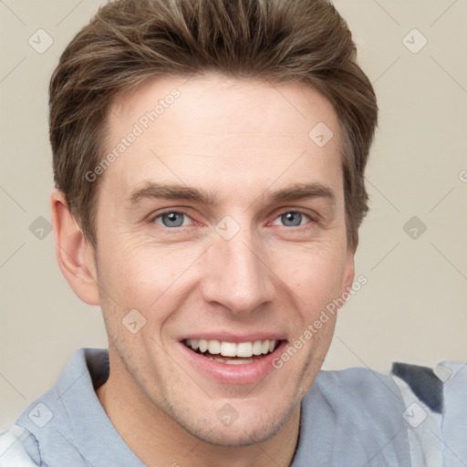 Joyful white adult male with short  brown hair and grey eyes