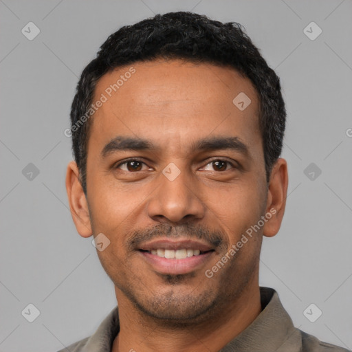 Joyful latino young-adult male with short  black hair and brown eyes