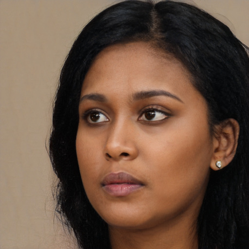 Neutral black young-adult female with long  black hair and brown eyes