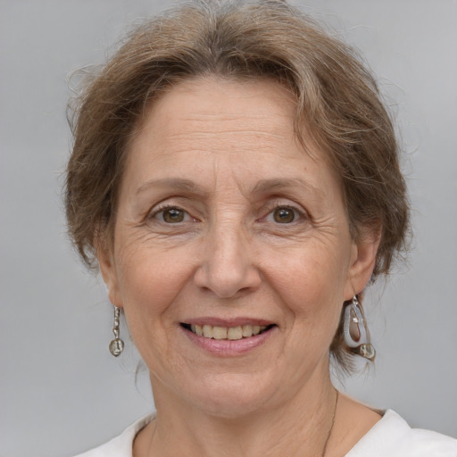 Joyful white middle-aged female with medium  brown hair and grey eyes