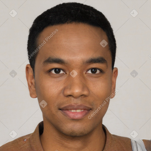 Joyful black young-adult male with short  black hair and brown eyes