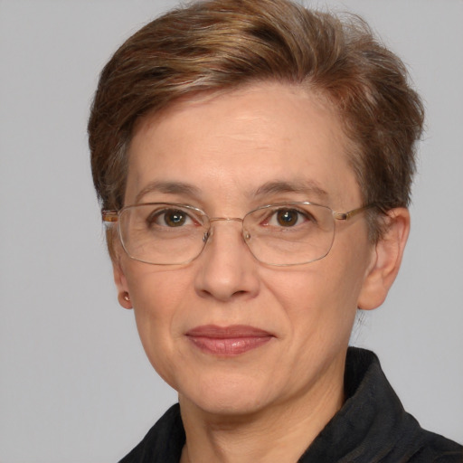 Joyful white middle-aged female with short  brown hair and grey eyes